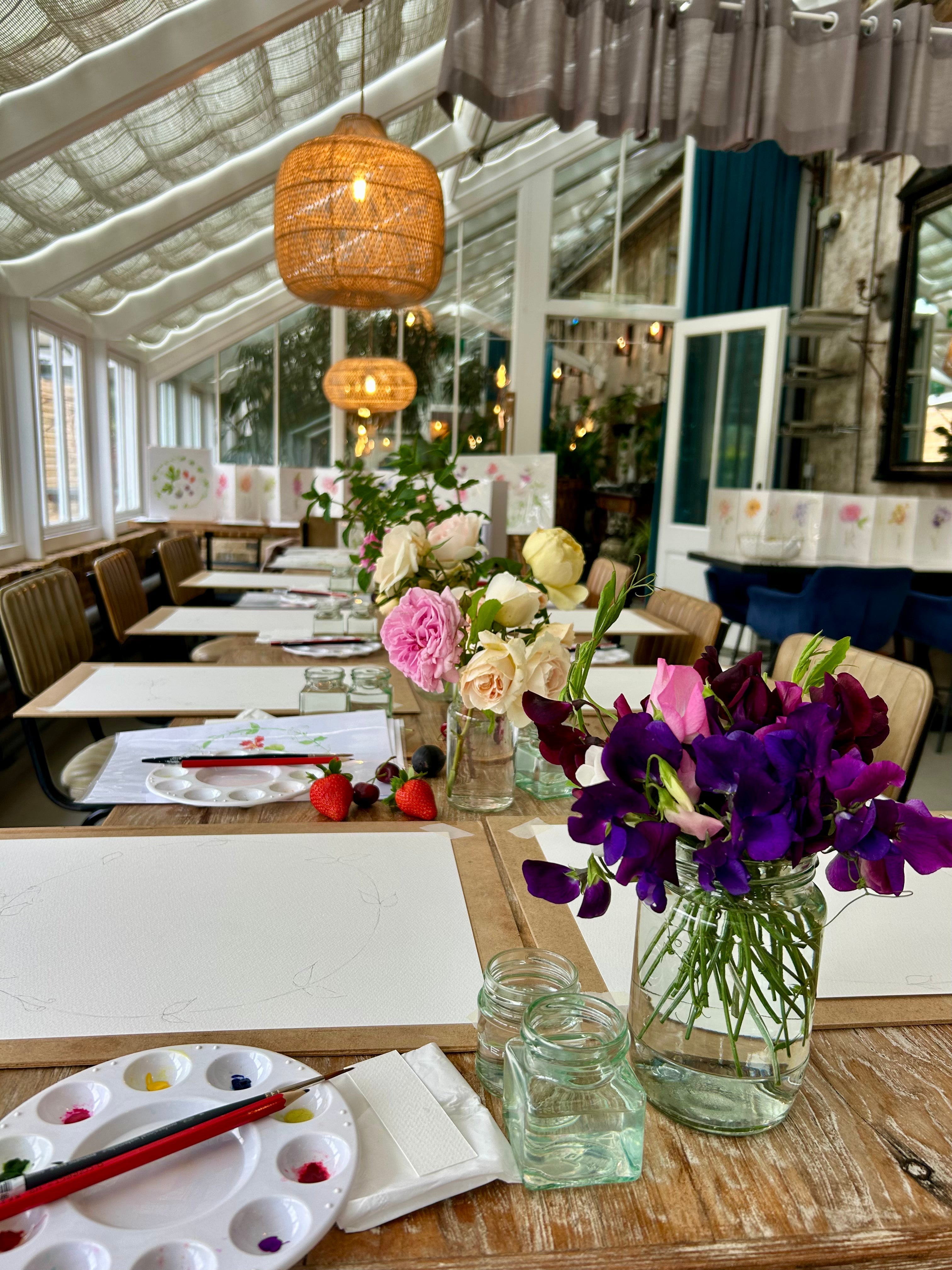 June roses and sweet peas decorate the table at The Grove botanical painting event.